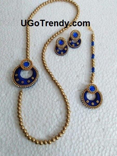 Golden tone Bead Necklace with Chandbali side pendant, matching Chandbali earring and maang tikka decorated with Rhinestones and metal beads