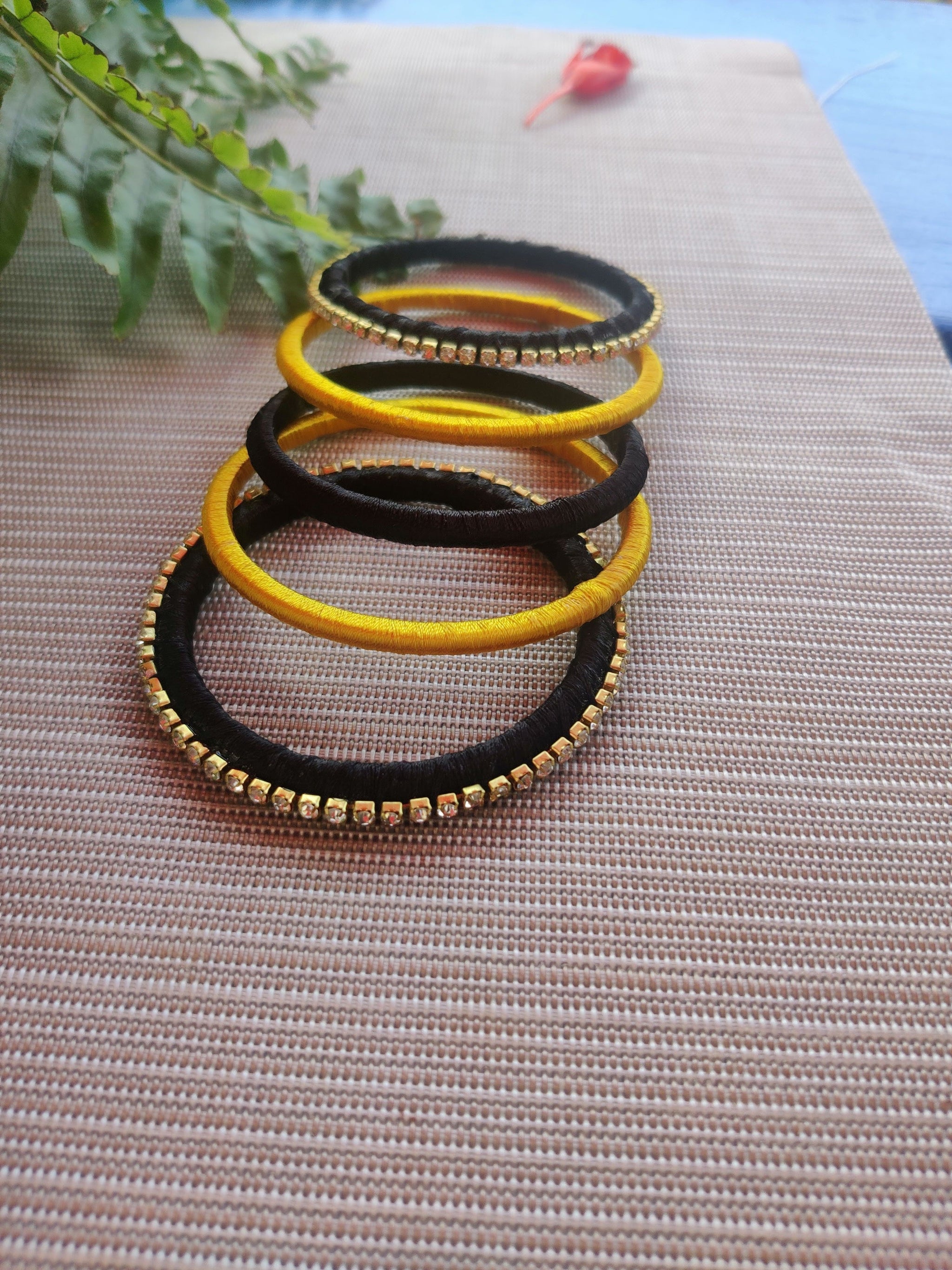 Set of 5 Black And Yellow Silk Thread Bangles