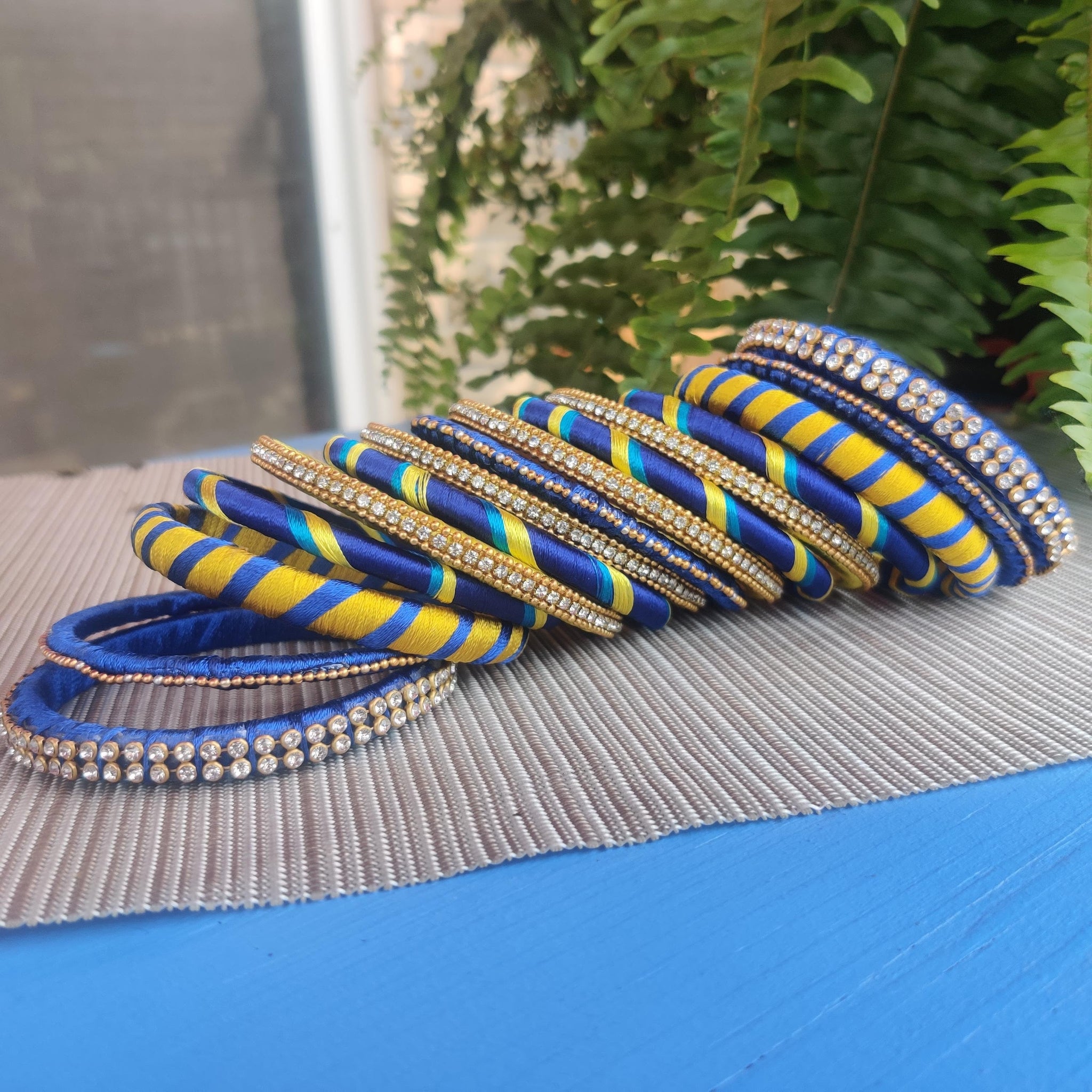 Set of 15 Blue And Yellow Silk Thread Bangles