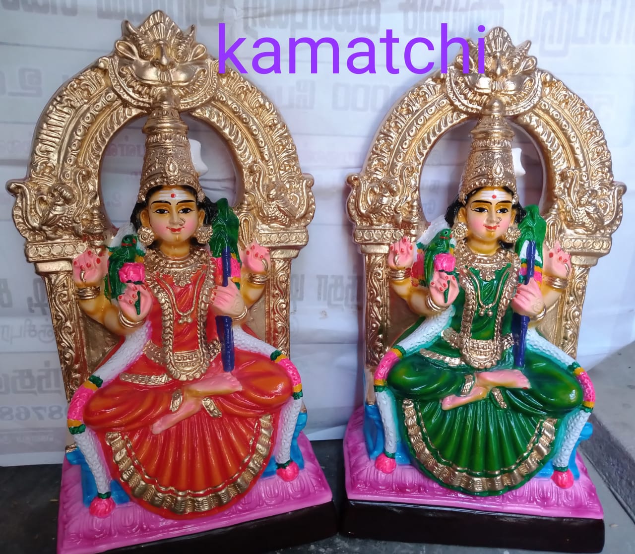 colorful Kamatchi Golu dolls made of paper mache, depicting Hindu goddesses in traditional attire, seated on a tiered platform.