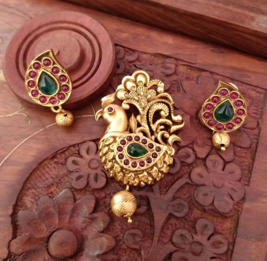 Antique Finish Peacock Pendant Set With Ruby Green Stones  And Matching Earrings