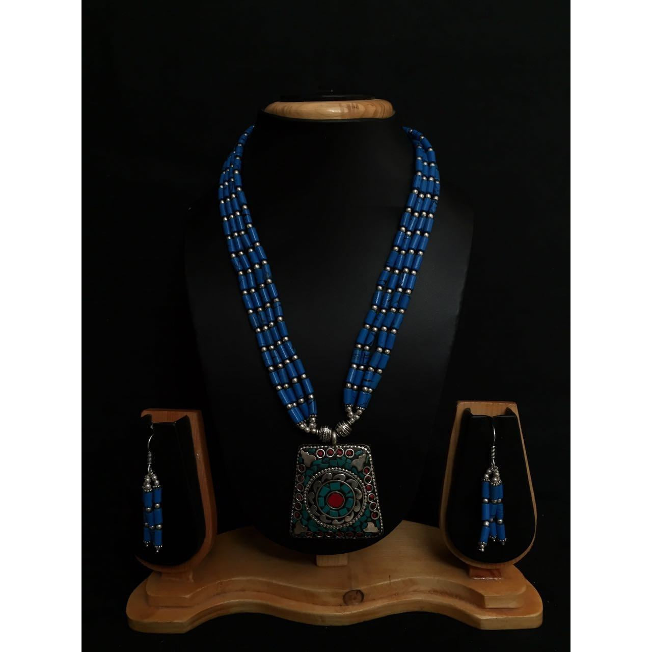 Necklace set with Nepalian Beads and German Silver pendant with coral and Turquoise beads and dangler earrings